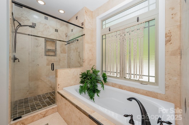 full bath featuring recessed lighting, a garden tub, plenty of natural light, and a shower stall