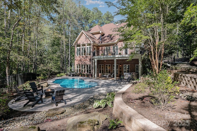 view of pool with fence, a fenced in pool, and a patio