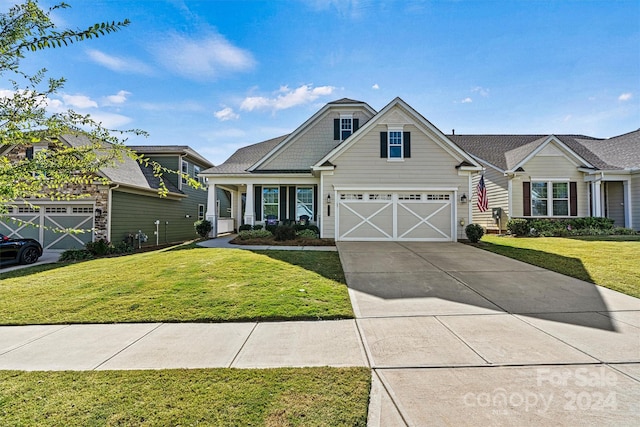 view of front facade featuring a front yard and a garage