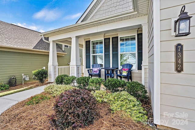 entrance to property featuring a porch