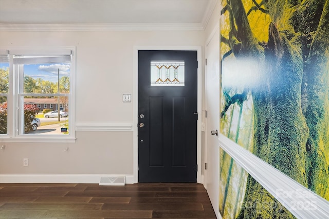 foyer featuring dark hardwood / wood-style flooring and ornamental molding