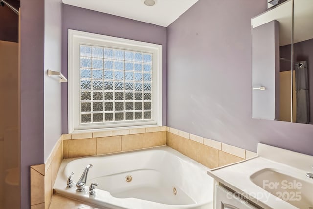 bathroom featuring vanity and a tub