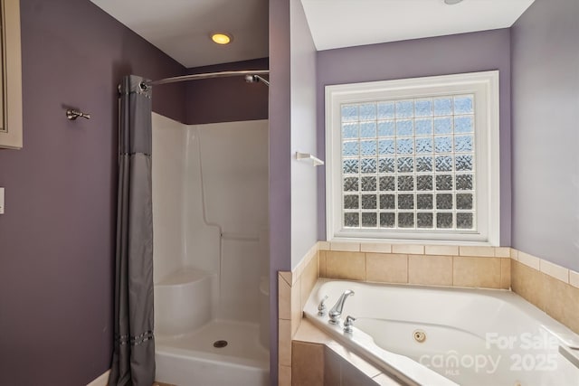 bathroom with shower with separate bathtub