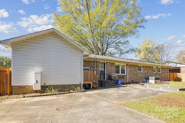 back of property with central AC