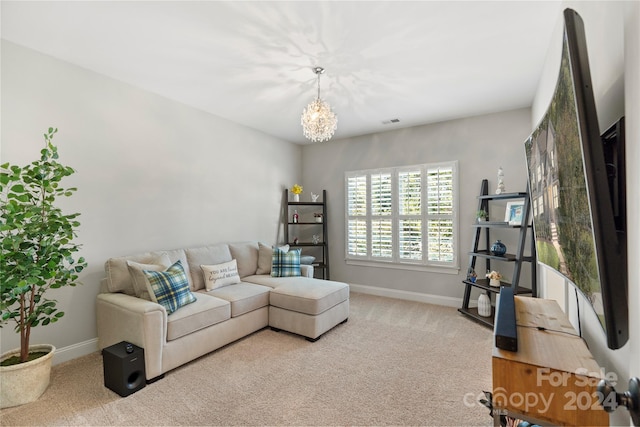 carpeted living room featuring a notable chandelier