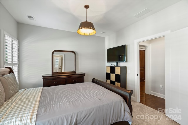 bedroom featuring dark hardwood / wood-style floors