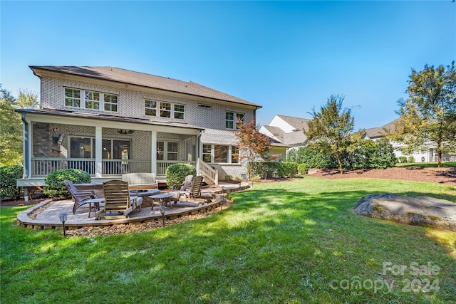 back of house featuring a patio area, outdoor lounge area, and a lawn