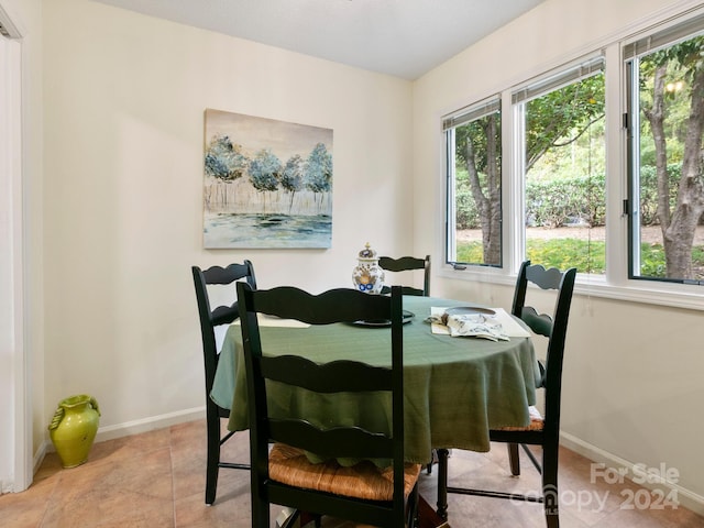 dining space with light tile patterned floors