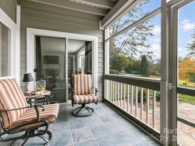 sunroom / solarium with beamed ceiling