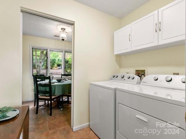 washroom with cabinets and separate washer and dryer