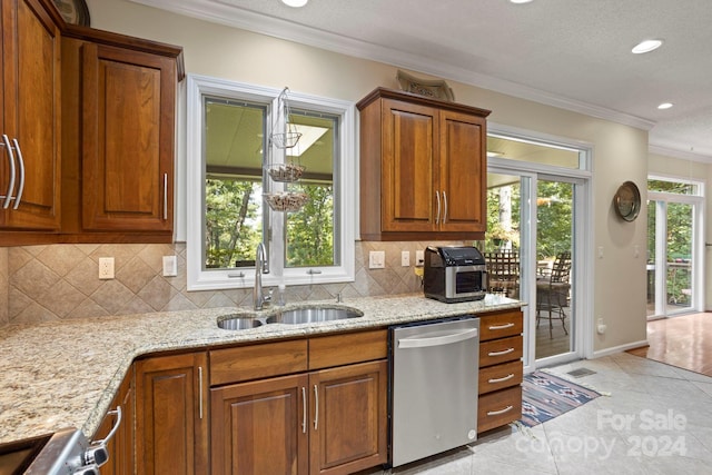 kitchen with sink, decorative backsplash, stainless steel dishwasher, ornamental molding, and light tile patterned floors