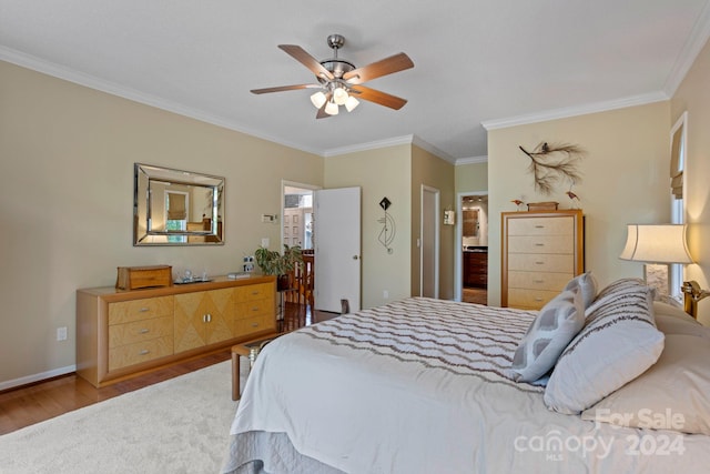 bedroom with ceiling fan, crown molding, and hardwood / wood-style floors