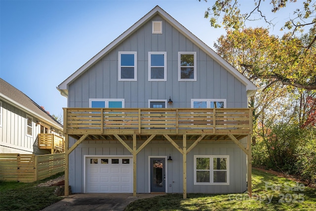 view of front of home featuring a garage and a deck