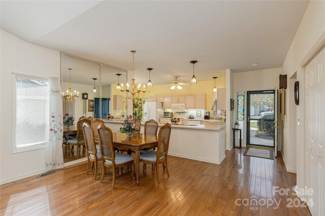 3 Country Meadows Ln, Hendersonville, NC 28792 - dining area featuring baseboards, light wood-style floors, visible vents, and ceiling fan with notable chandelier