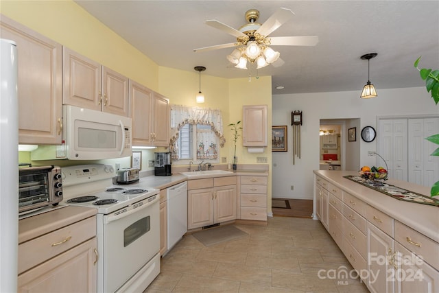 kitchen with ceiling fan, decorative light fixtures, sink, and white appliances