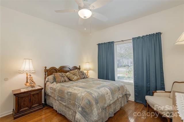 bedroom with ceiling fan and hardwood / wood-style floors