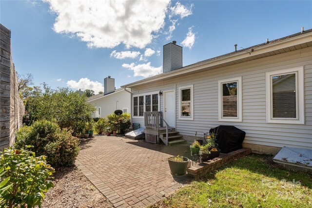 3 Country Meadows Ln, Hendersonville, NC 28792 - rear view of house featuring a patio area and a chimney