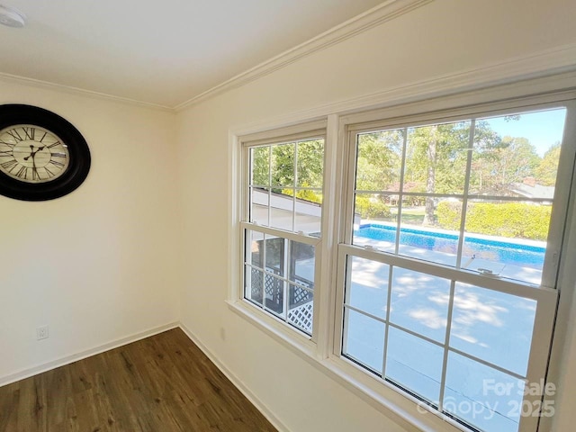 interior space featuring dark wood-type flooring and crown molding