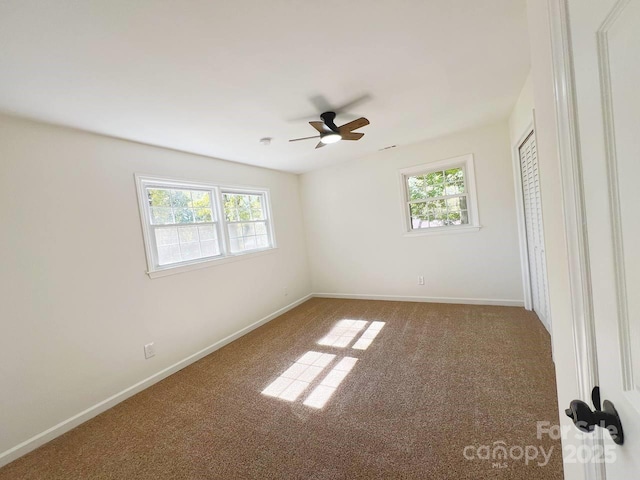 carpeted empty room with ceiling fan