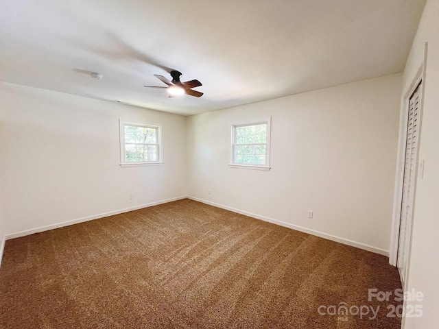 unfurnished bedroom with a closet, carpet flooring, and ceiling fan