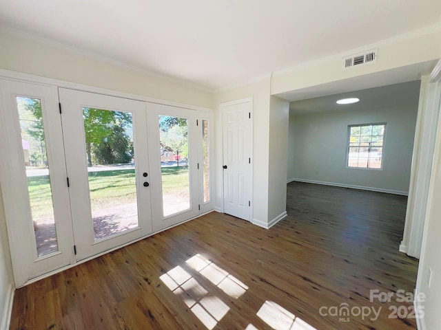 doorway to outside with french doors, crown molding, and dark hardwood / wood-style floors