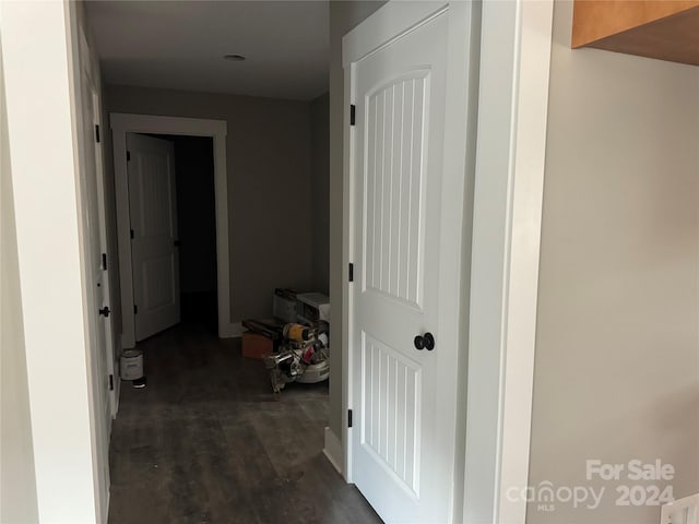 corridor featuring dark wood-type flooring