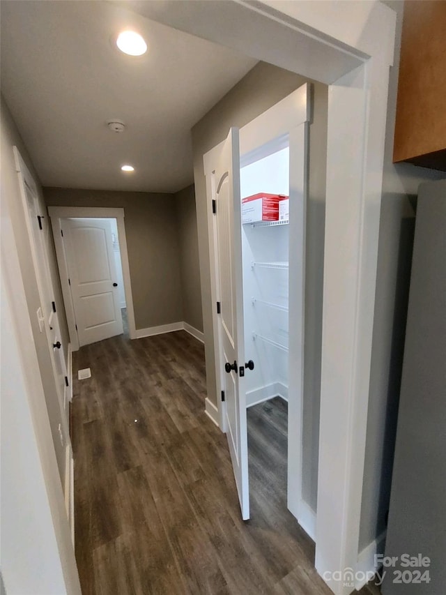 hallway featuring dark hardwood / wood-style floors