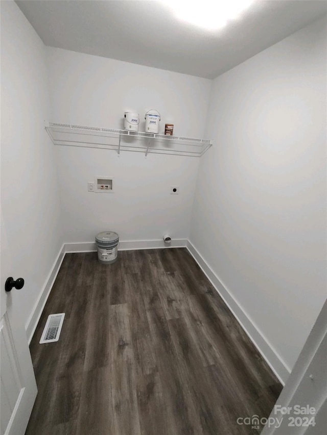 laundry area featuring hookup for an electric dryer, dark hardwood / wood-style flooring, and washer hookup