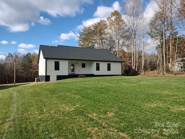 exterior space with a yard and central AC