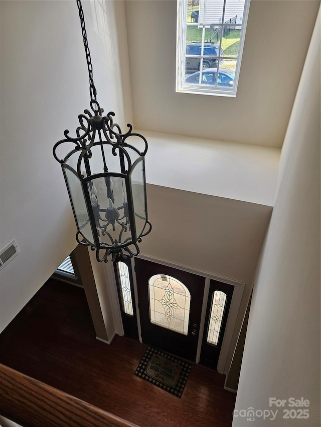 room details featuring hardwood / wood-style flooring and a notable chandelier