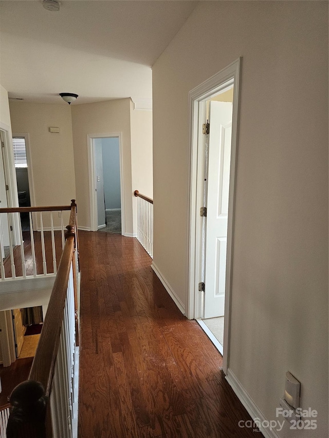 hallway with dark hardwood / wood-style floors