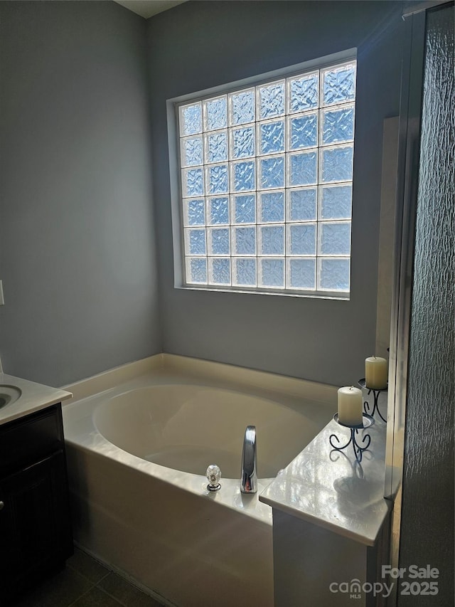 bathroom featuring a bathtub and vanity