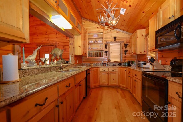 kitchen featuring lofted ceiling, sink, wood ceiling, black appliances, and light wood-type flooring