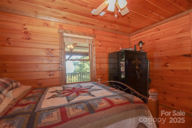 bedroom with wood ceiling and ceiling fan