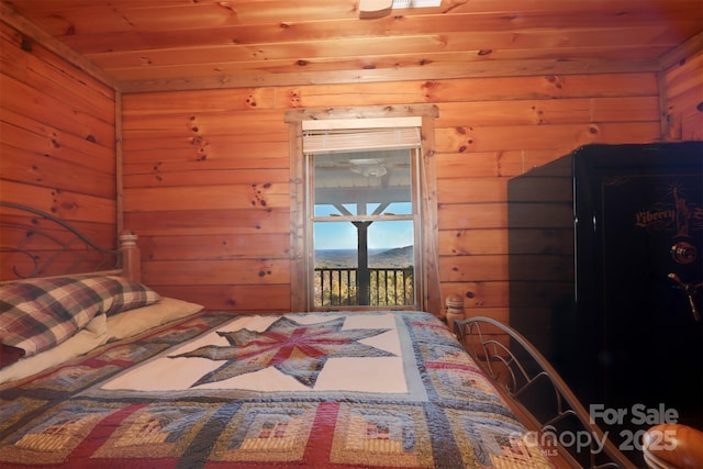 unfurnished bedroom featuring wood ceiling, access to outside, and wooden walls