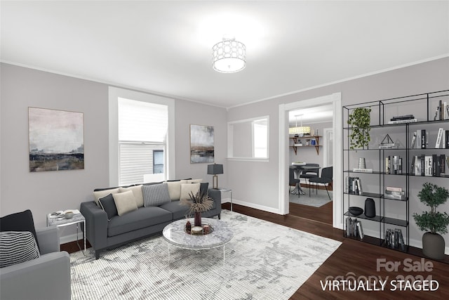 living room with hardwood / wood-style flooring and ornamental molding