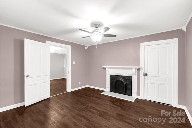 unfurnished living room featuring ceiling fan, dark hardwood / wood-style flooring, and crown molding