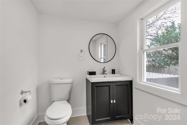 bathroom with vanity and toilet