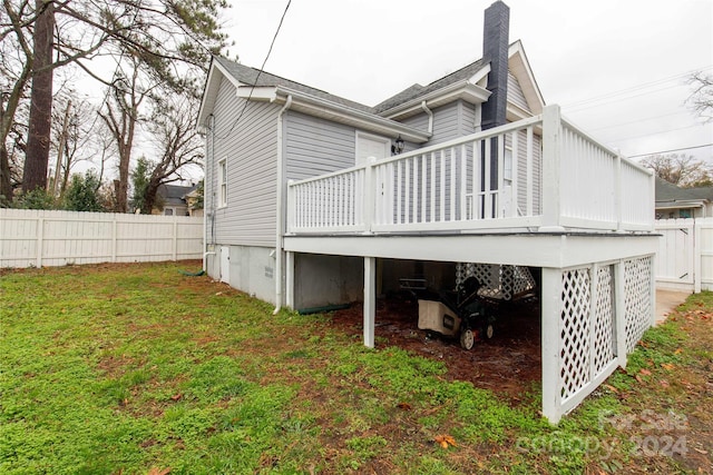 view of home's exterior featuring a yard and a deck