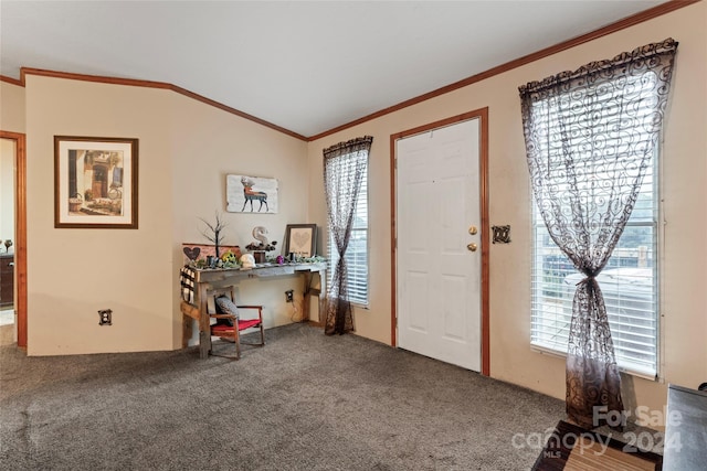 carpeted foyer featuring lofted ceiling and crown molding