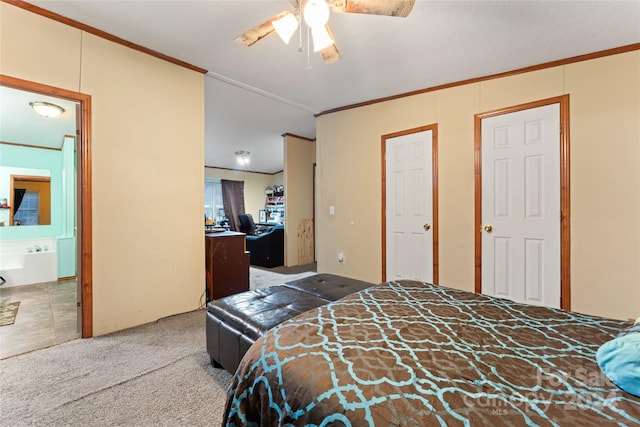 carpeted bedroom with crown molding, connected bathroom, and ceiling fan