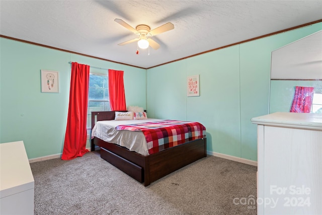 bedroom featuring ceiling fan, light carpet, a textured ceiling, and crown molding