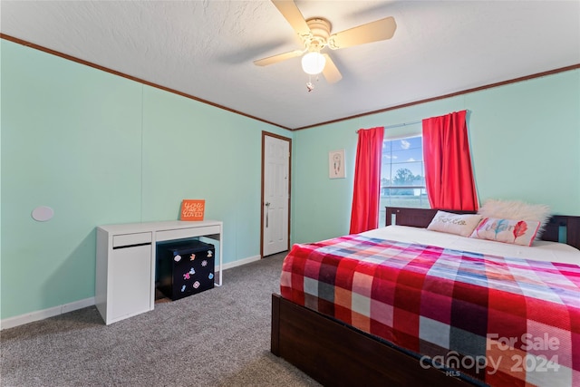 bedroom featuring crown molding, a textured ceiling, carpet, and ceiling fan