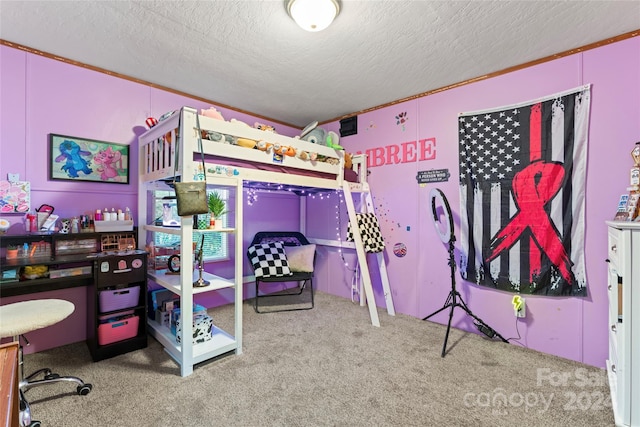 bedroom with a textured ceiling and carpet floors