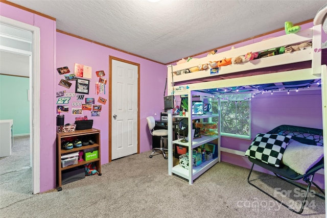 bedroom featuring carpet and a textured ceiling