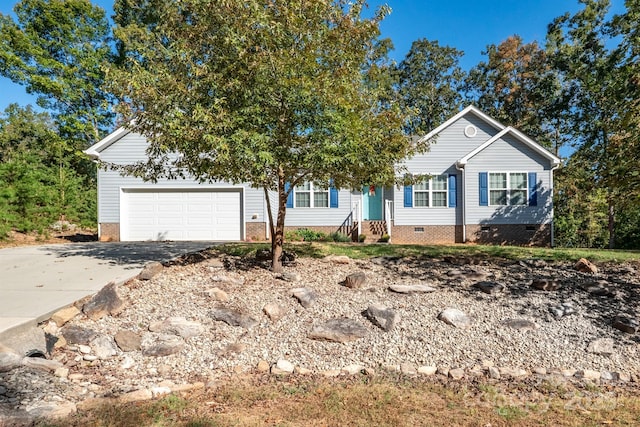 view of front of property with crawl space, an attached garage, and driveway