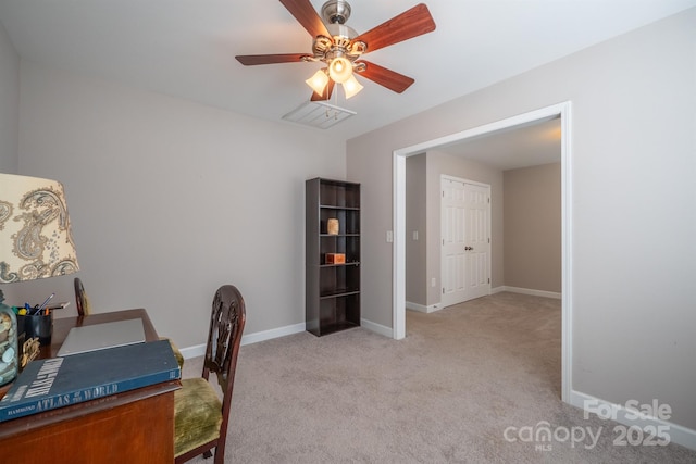 carpeted office with visible vents, a ceiling fan, and baseboards