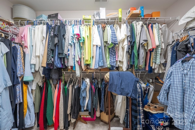 spacious closet with visible vents and carpet floors