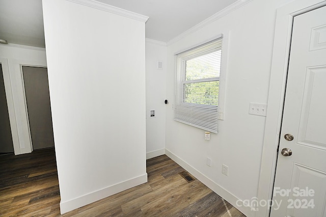 interior space with ornamental molding and dark hardwood / wood-style floors