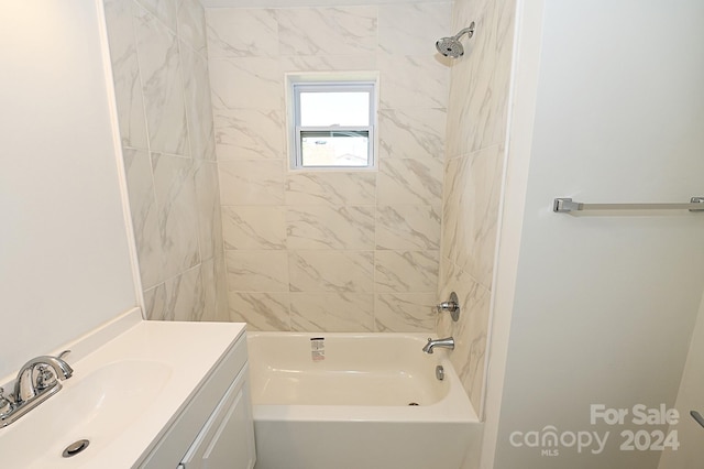 bathroom featuring vanity and tiled shower / bath combo